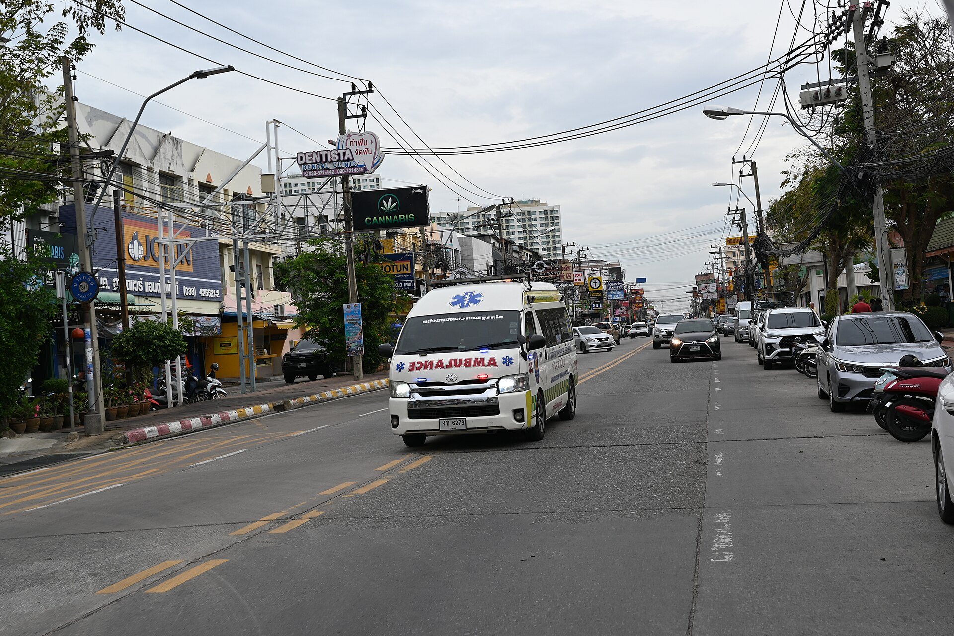 An ambulance in Thailand with AMBULANCE written in mirror image above the grille