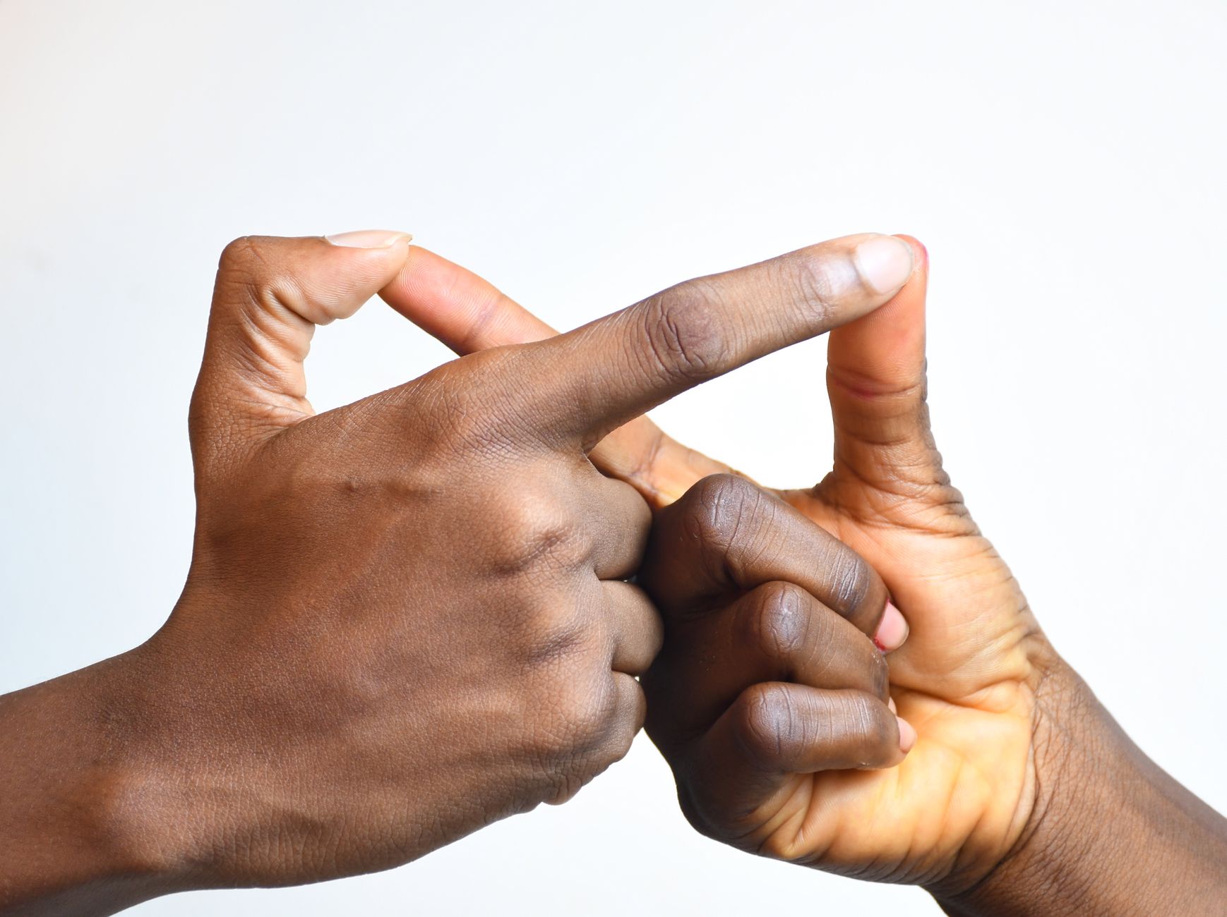 Two hands with crossed fingers