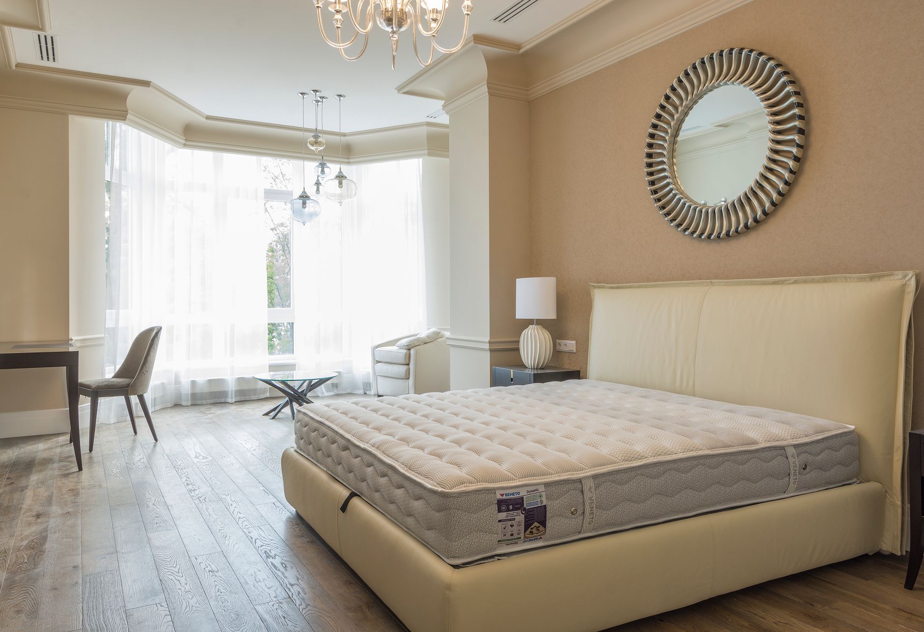 A new mattress on a bed frame with its label visible on the side