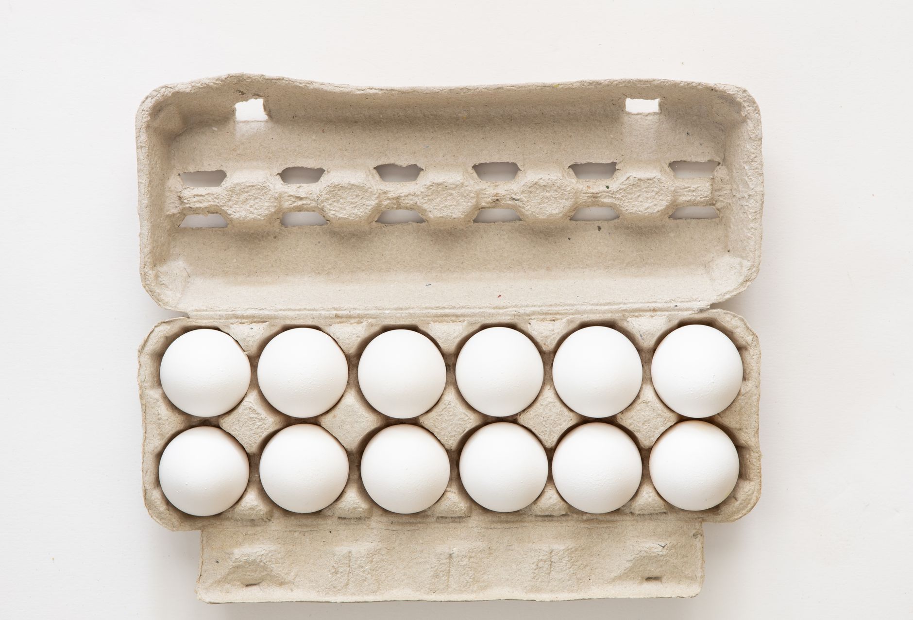 A carton of twelve white eggs